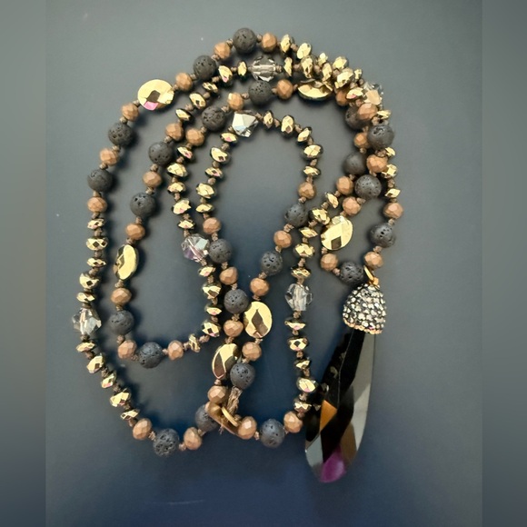 Jewelry - Long necklace with gold, black and brown
Accents